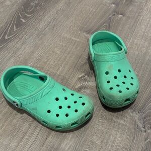 Junior teal crocs